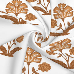 Fabric close-up of long lumbar pillow cover with rust block-print-inspired floral sprigs