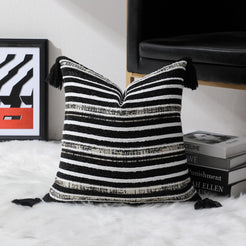 Black and ivory striped chenille-textured polyester square pillow cover in a room setting