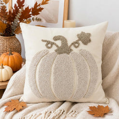 Tufted polyester pillow cover with a filled cream pumpkin, shown on a cream chair
