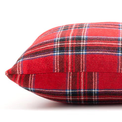Woven polyester pillow cover with classic red tartan, shown in hand for scale
