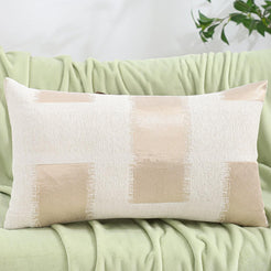Chenille jacquard polyester pillow covers with beige abstract patchwork squares, shown as a lumbar cover on a neutral sofa