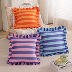 Pink and purple striped velvet polyester pillow covers with ruffled edges, stacked in a mixed-color display