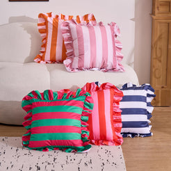 Red and pink striped velvet polyester pillow covers with ruffled edges, arranged in a mixed-color display